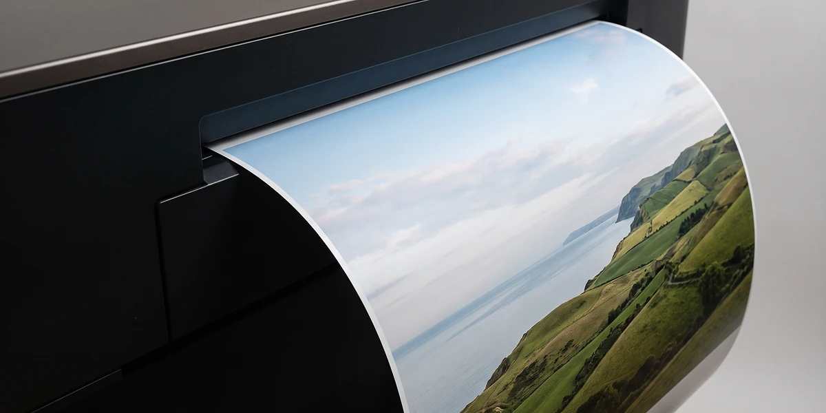 Large format colour printing – a poster-size print coming out of a wide-format printer